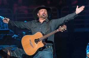 Garth Brooks addresses the crowd with his GB7C Signature Acoustic Guitar by Takamine