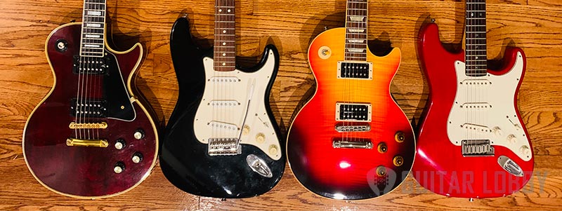 Les-Paul Guitars next to Stratocaster Guitars