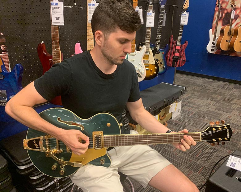 Me playing a Gretsch Streamliner Hollowbody Guitar